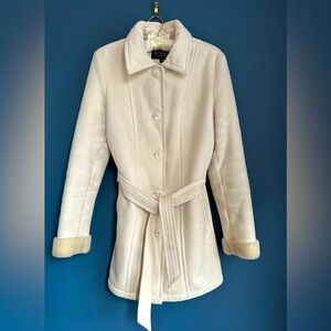 Beautiful beige, washable suede coat with soft pile interior lining throughout.